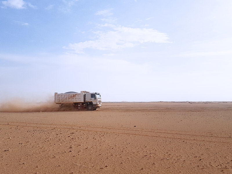 SINOTRUK dump truck is running in interior of the Sahara, the truck still remains stable status.